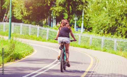 Wallpaper Mural Cyclist ride on the bike path in the city Park
 Torontodigital.ca