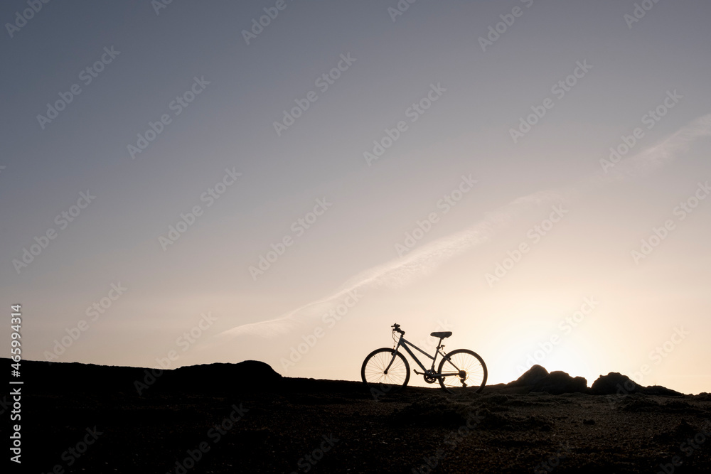 bike ride on the beach at sunrise