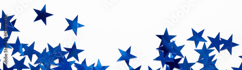 Fototapeta Naklejka Na Ścianę i Meble -  banner of Christmas border with blue star confetti. Holiday background for New Year on white