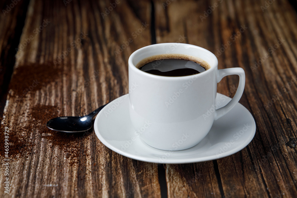 Cup of espresso coffee on wooden table Cup of espresso coffee on wooden table