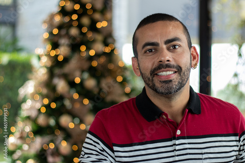 Portrait of an excited, happy young man in the background. Christmas decoration, Christmas day, Merry Christmas photo