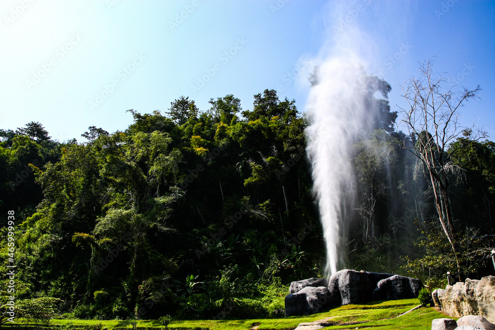 Fototapeta premium high fountain in the park with sky