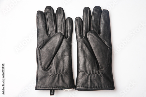 Fashion black leather gloves on white background