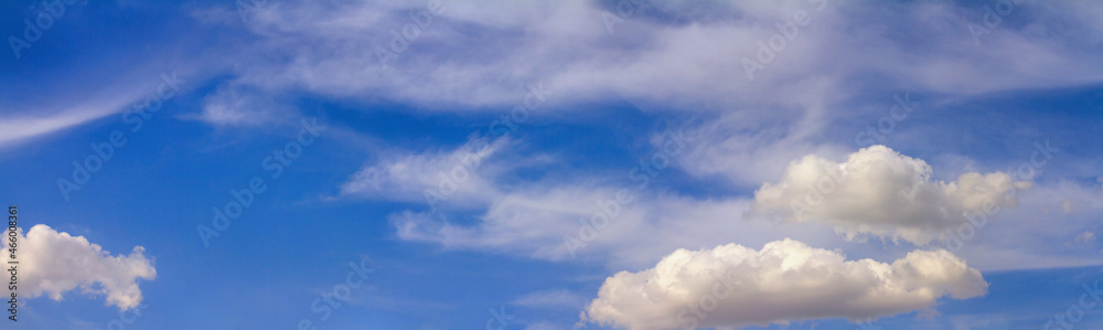 Fototapeta premium Blue sky landscape with white clouds. Horizontal banner with free copy space for text