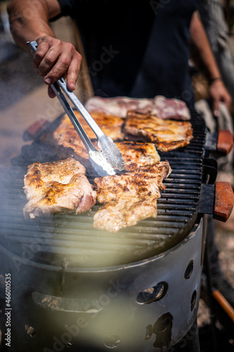 Traditional Argentine asado on the grill with charcoal and fire cooked in the open air
