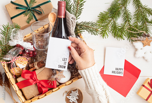 Photography Refined Christmas gift basket for culinary enthusiats with bottle of wine and mulled wine ingredients