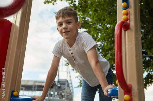 Bilde på lerret little caucasian kid playing at playground