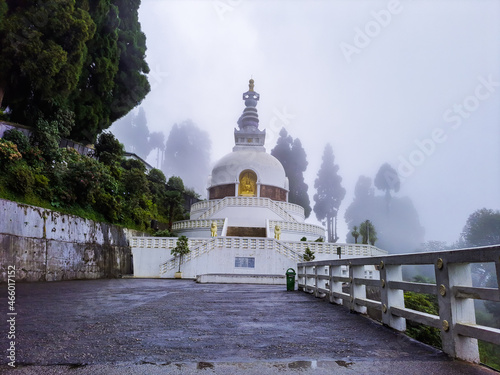 Wallpaper Mural buddhist shanti stupa covered with cloud at morning from different angle