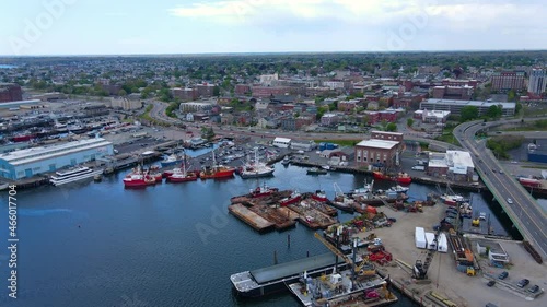 Flying over New Bedford port from Acushnet River to Historic city center of New Bedford including Whaling National Historic Park, New Bedford, Massachusetts MA, USA.  photo