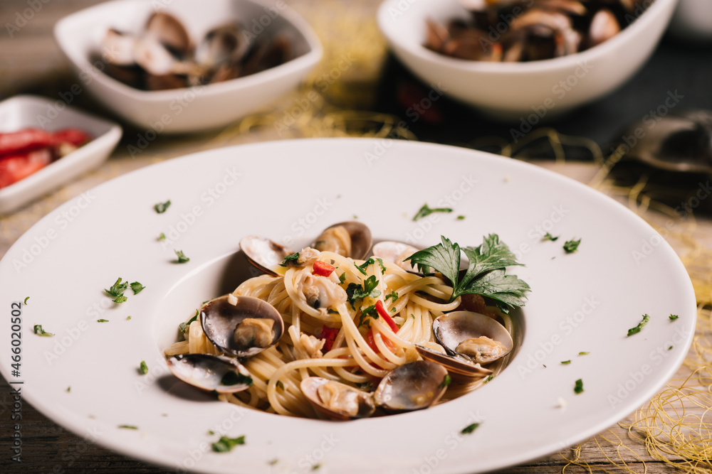 Closeup of spaghetti dish with clams on a white dish Closeup of spaghetti dish with clams on a white dish
