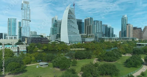 Auditorium Shores at Town Lake Dog Park and View of Colorado River and Downtown Austin Texas Skyline (Aerial Drone View in 4k) photo