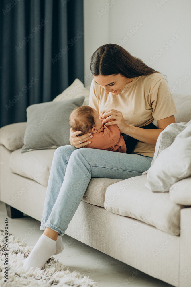 Mother with her baby girl at home Mother with her baby girl at home