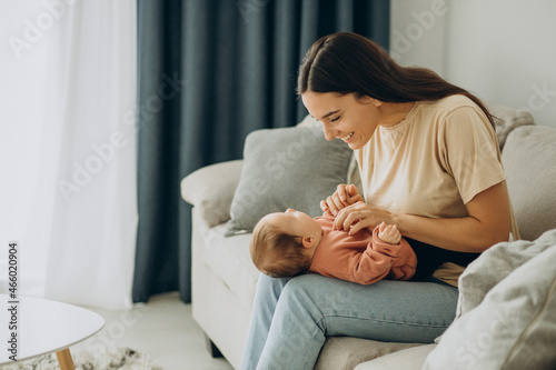 Mother with her baby girl at home photo