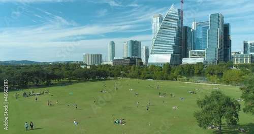 Auditorium Shores at Town Lake Dog Park and View of Colorado River and Downtown Austin Texas Skyline (Aerial Drone View in 4k) photo