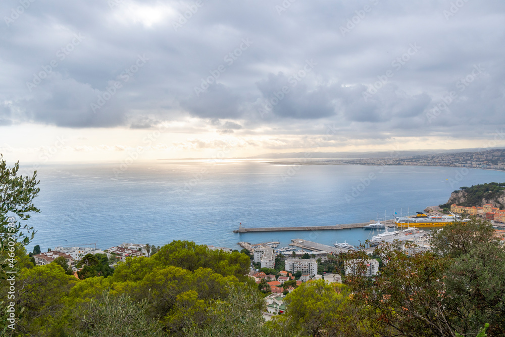 View from the Mont Boron lookout over the old city, Mediterranean Sea, and Port Lympia on the Riviera coast of Southern France as the sun comes up.