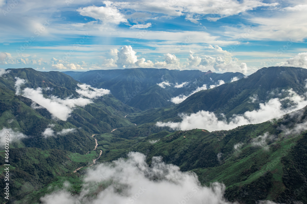 mountain range valley filled with low clouds with dramatic sky at morning