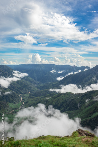 mountain range valley filled with low clouds with dramatic sky at morning