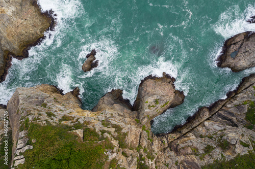 Top down view of the sea crash on rock