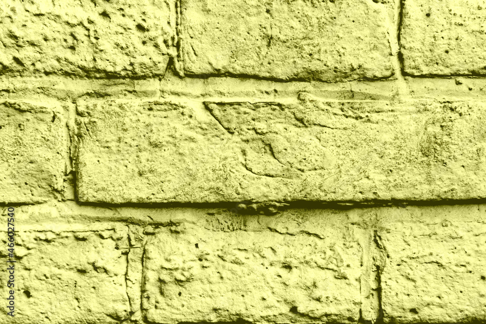 Texture of a brick wall with cracks and scratches which can be used as a background