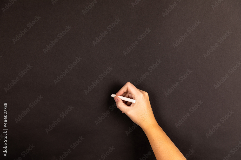 Naklejka premium hand writing on a blackboard