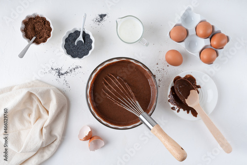 Cooking chocolate dough. Pie. Cake ingredients. White background. On the kitchen 