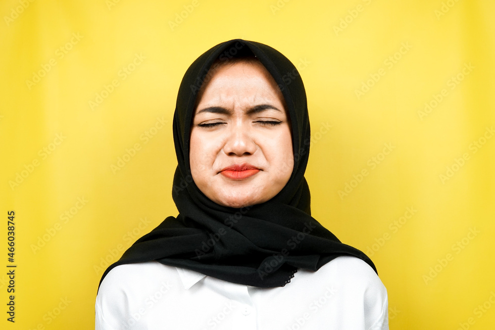 Closeup of beautiful young muslim woman sad, sullen, unhappy, isolated Closeup of beautiful young muslim woman sad, sullen, unhappy, isolated