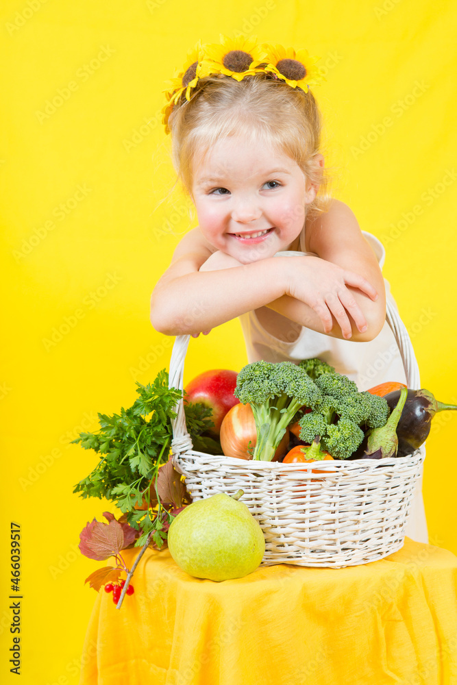 Beautiful little happy girl with basket vegetables and fruits Beautiful little happy girl with basket vegetables and fruits