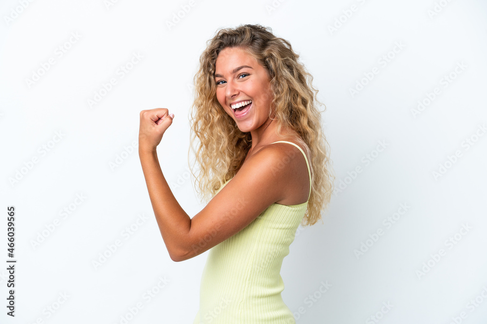 Girl with curly hair isolated on white background celebrating a victory Girl with curly hair isolated on white background celebrating a victory