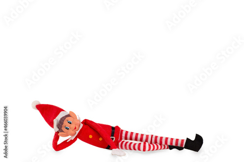 Christmas Elf toy on an isolated white background with copy space. Christmas spirit, Christmas shelf tradition. photo