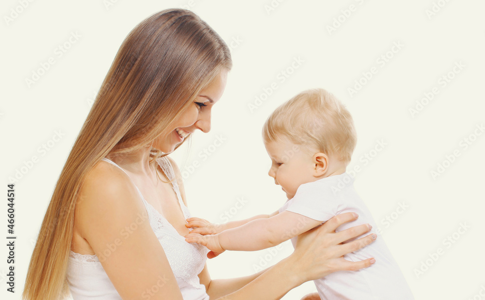 Portrait of happy cheerful smiling mother and baby playing together on a white background