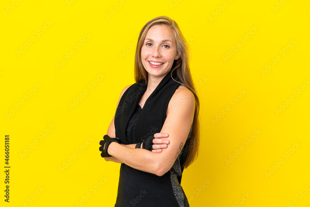 Young sport English woman isolated on white background with arms crossed and looking forward Young sport English woman isolated on white background with arms crossed and looking forward