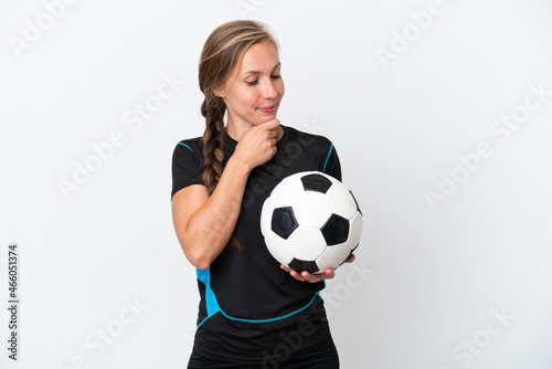 Young football player woman isolated on white background looking to the side and smiling © luismolinero