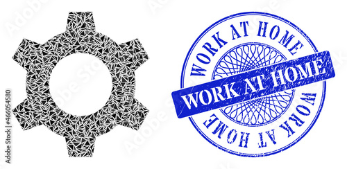 Cog collage of triangle particles, and Work at Home textured seal print. Blue stamp contains Work at Home tag inside round form. Vector cog collage is formed of different triangle elements.