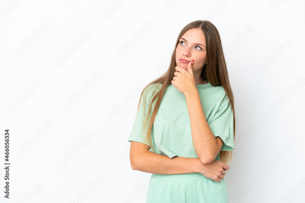 Young Lithuanian woman isolated on white background having doubts Young Lithuanian woman isolated on white background having doubts