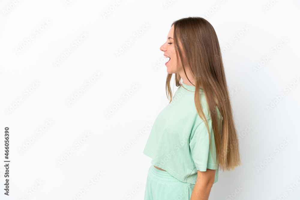 Young Lithuanian woman isolated on white background laughing in lateral position Young Lithuanian woman isolated on white background laughing in lateral position