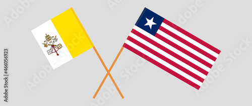 Crossed flags of Vatican and Liberia. Official colors. Correct proportion