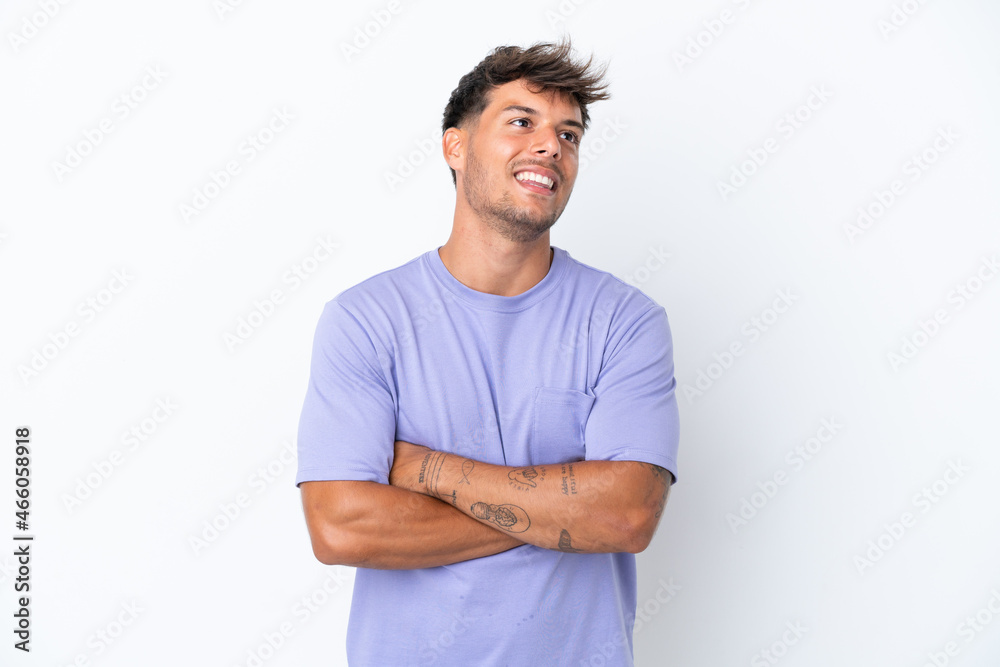 Young caucasian handsome man isolated on white background looking up while smiling Young caucasian handsome man isolated on white background looking up while smiling