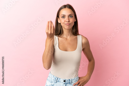Young woman over isolated pink background making Italian gesture
