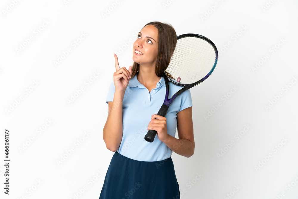 Woman playing tennis over isolated white wall pointing up a great idea Woman playing tennis over isolated white wall pointing up a great idea