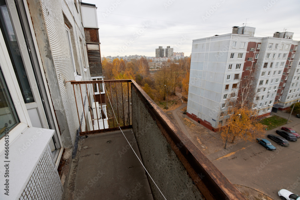Balcony view of soviet Leningrad project house. courtyard of residential building. Selective focus Balcony view of soviet Leningrad project house. courtyard of residential building. Selective focus
