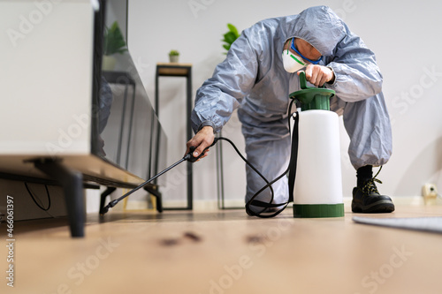Pest Control Exterminator Man Spraying Termite Pesticide