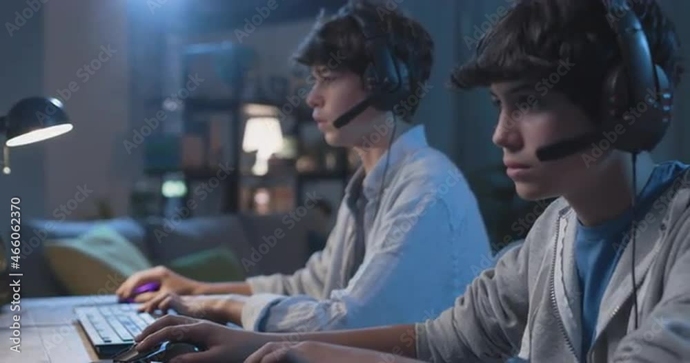 Young gamers playing video games together Young gamers playing video games together