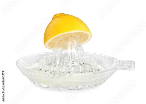 Fotografie Glass squeezer and halved fresh lemon on white background