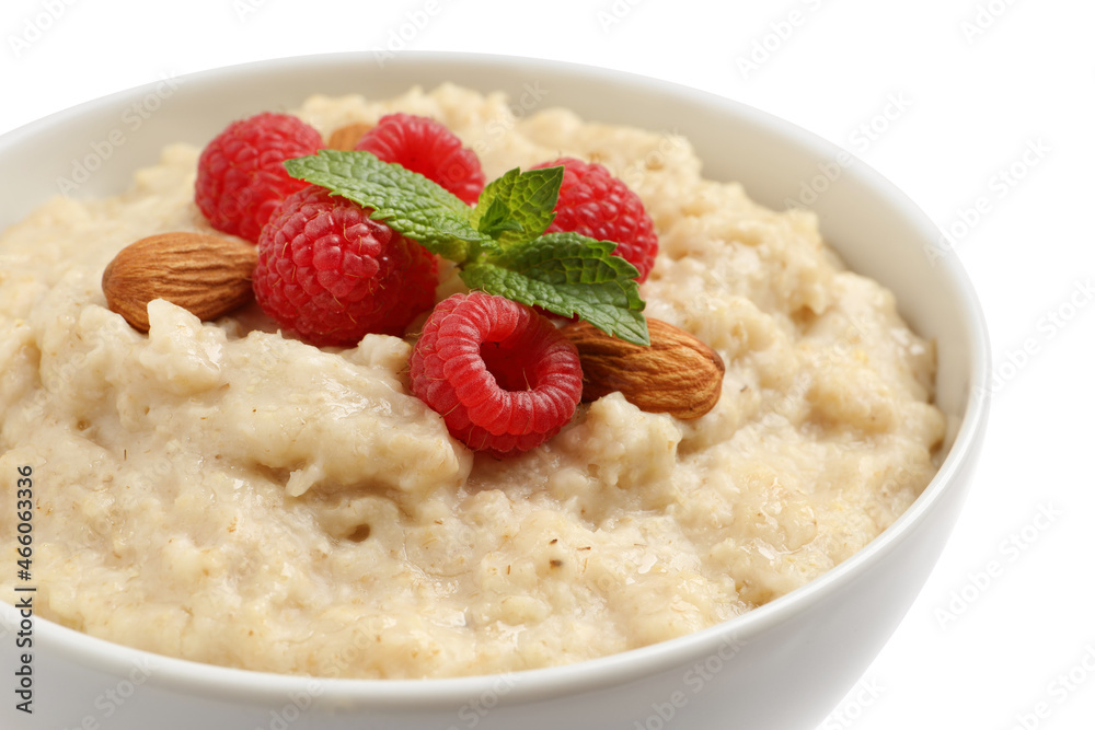 Tasty oatmeal porridge with raspberries and almond nuts in bowl on white background, closeup Tasty oatmeal porridge with raspberries and almond nuts in bowl on white background, closeup