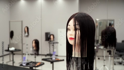 several mannequin heads for practice