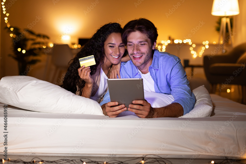 Couple Using Digital Tablet And Credit Card Shopping Online Indoor Couple Using Digital Tablet And Credit Card Shopping Online Indoor