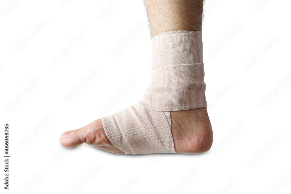 Young athlete's leg has ankle pain and Elastic Bandage is attached to the ankle. Concept of health.