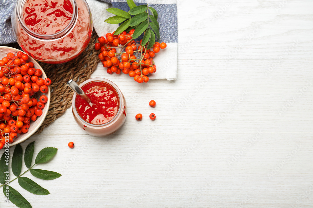 Flat lay composition with delicious rowan jam on white wooden table. Space for text Flat lay composition with delicious rowan jam on white wooden table. Space for text