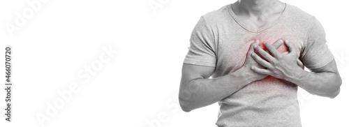 Fotografía Unrecognizable millennial caucasian guy suffering from chest pain, presses hand