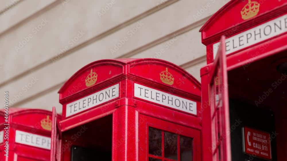 Seamless looping animation with red phone booths on the wall background. Seamless looping animation with red phone booths on the wall background.